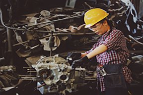 Image: woman working on machine