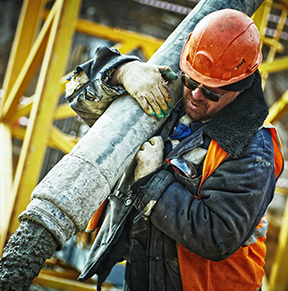 Image: worker pouring cement