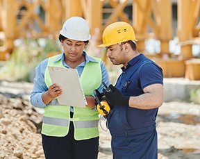 Image: 2 maintenance workers talking