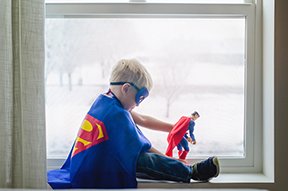 Image: child in Superman outfit