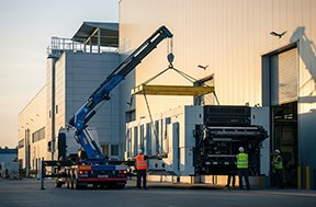 A factory finalizing an asset acquisition integrated with a CMMS system.