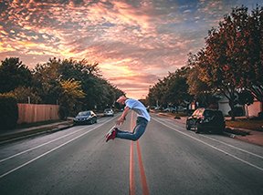 Image: man arching body in street