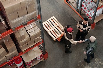 Image: warehouse workers being introduced to each other