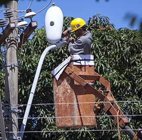 Image: man working on street light